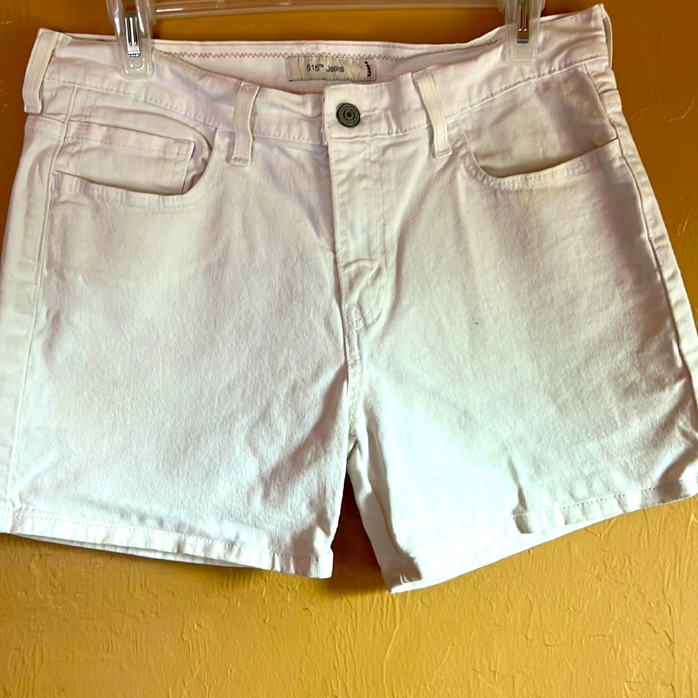 Levi Strauss and Company white jean shorts.